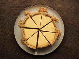 cut New York cheesecake slices on wood