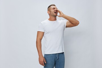 Man runny nose and cough, cold and flu, allergies, pain, in white t-shirt on white isolated...
