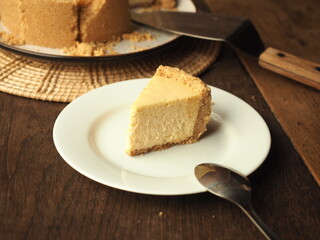 slice of New York cheesecake on white plate