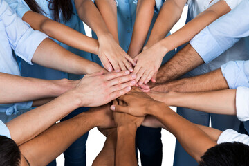 Top View of People in Circle with Their Hands Together