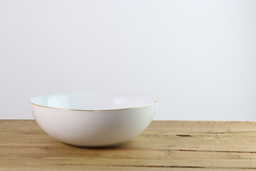 empty ceramic bowl on a wooden table