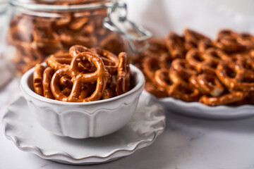 Mini pretzels in a  bowl, salty healthy snack