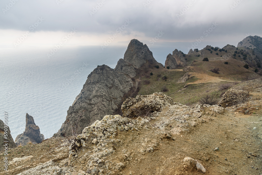 Wall mural Landscape of Karadag Reserve in spring. View of rocks of ridge Karagach. Crimea