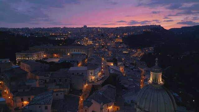sunset flying backwards view of Ragusa Ibla in Sicily