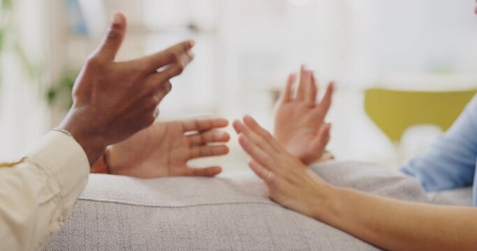 Couple, divorce and hands in argument, sofa and anger of frustrated problems, blame and crisis. Closeup of angry man, woman and partner fighting in toxic relationship, drama and conflict of cheating
