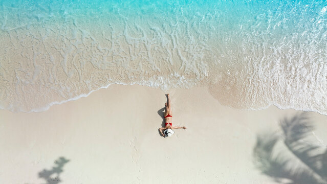 Aerial view with sand beach sunbathing lying -Summer fashion concept