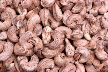 close up of peanuts on a white background