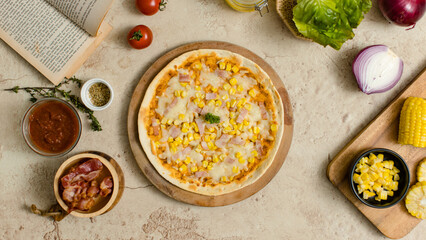 Top view closeup shot of delicious tasty juicy thin crispy cheesy corn and ham Italian pizza placed...