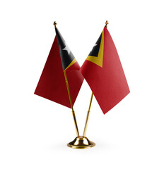 Small national flags of the East Timor on a white background