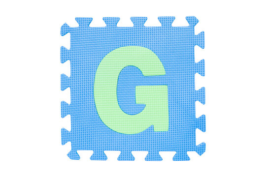 Jigsaw English English uppercase "G" alphabet foam plastic Isolated on cutout PNG. Jigsaw box with character. Colorful foam alphabet puzzle pieces. English used in learning education for children.