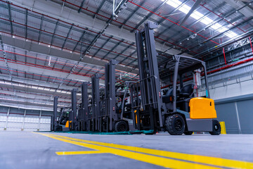 Group of forklifts truck in large warehouse © Kittisak