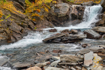 Flowing water in autumn. Abisko national park in north of Sweden.