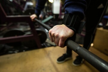 Weightlifters hands in an oldschool bodybuilding gym