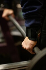 Weightlifters hands in an oldschool bodybuilding gym