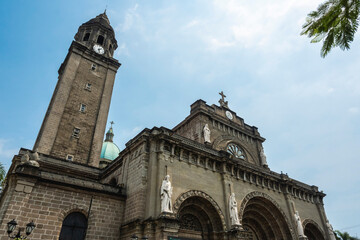 Fototapeta na wymiar Intramuros, Manila, Philippines - The facade of Manila Cathedral during a hot sunny April.