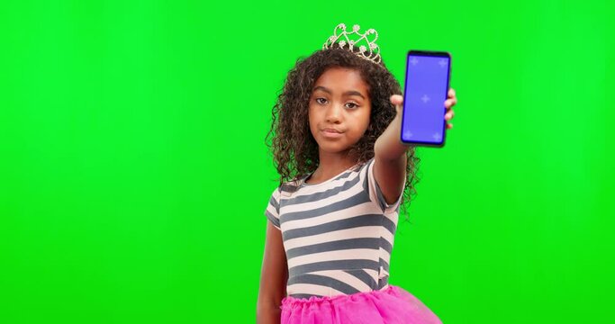 Girl child, princess and phone by green screen for fantasy, magic wand or face with tracking markers ux. Female kid, royal and smartphone with mock up space for costume, creative and games in studio