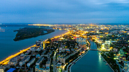 Astrakhan, Russia. Panorama of the city, twilight. Night city lights. Aerial view