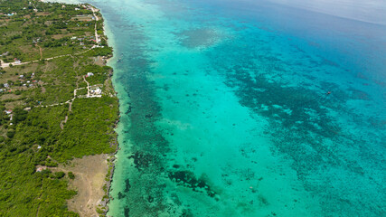 Aerial view of Tropical sandy beach and blue sea. Bantayan island, Philippines.