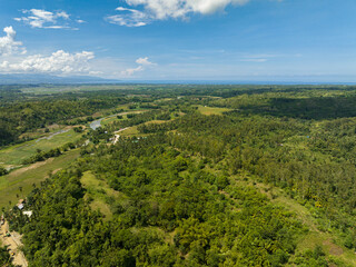 Fototapeta na wymiar Aerial view of farm and farmland with crops in the mountainous area. Negros, Philippines
