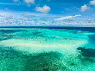 Sandbar among atol and coral reef. Balabac, Palawan. Philippines.