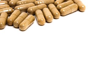 Capsules. Herb capsule, Nutritional Supplement, Vitamin Pill, Herbal Medicine on white background. Copy Space