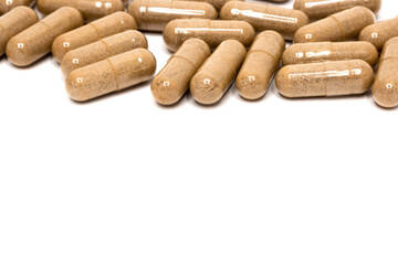 Capsules. Herb capsule, Nutritional Supplement, Vitamin Pill, Herbal Medicine on white background. Copy Space