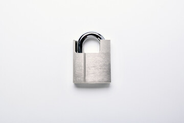 Naklejka premium New padlock on white background.