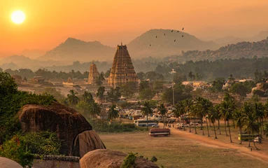 Papier Peint photo Lieu de culte Virupaksha temple with scenic Hampi landscape and cityscape at sunset at Karnataka India