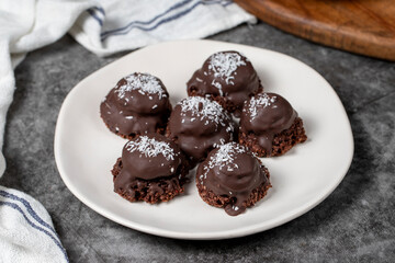 Coconut and chocolate chip cookies..Bakery products. Cookies with tea on dark background. Close up