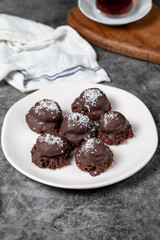 Coconut and chocolate chip cookies..Bakery products. Cookies with tea on dark background