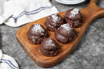 Coconut and chocolate chip cookies..Bakery products. Cookies with tea on dark background. Close up