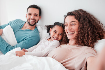 Obraz na płótnie Canvas Selfie, bedroom and portrait of parents with girl in bed relax for quality time, bonding and love in morning. Family home, face and happy mother, father and child smile for picture, post and memory