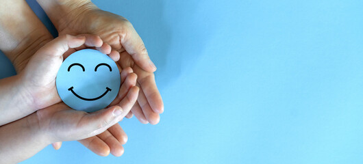 Hand holding paper cut circle symbol face smile, happy, relax,  satisfaction survey, customer...