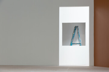 The stairs placed in the unfinished room In the view through the windows and doors with a bright light in the middle to see the dimension of the picture, strangely beautiful