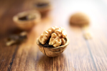 Fototapeta na wymiar Chopped walnuts on a wooden table