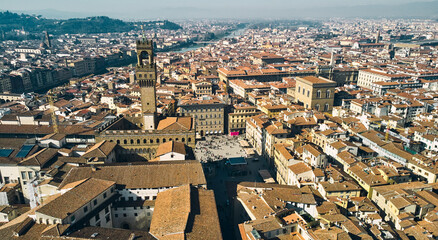 Obraz premium Aerial view of famous tower and Palazzo Vecchio square and Florence cityscape, Italy. High quality photo