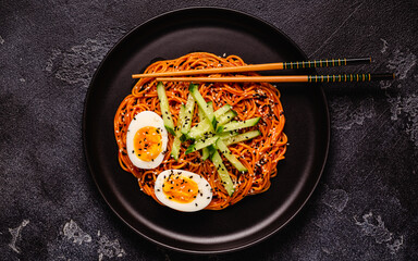 Korean traditional food, cucumber and boiled egg cold spicy noodles.
