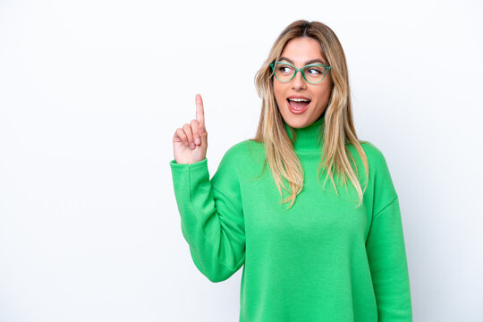 Young Uruguayan woman isolated on white background intending to realizes the solution while lifting a finger up