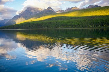 Bowman Lake against the green hills in the Glacier National park