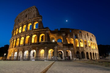 View of the historic Colosseum in Rome, Italy with the night sky