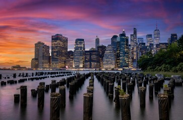 View of the famous Old Pier 1 park in Brooklyn, New York with beautiful night sky and city skyline