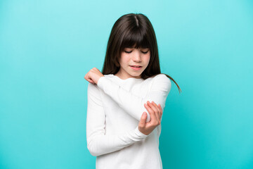 Little caucasian girl isolated on blue background with pain in elbow