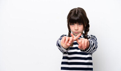 Naklejka premium Little caucasian girl isolated on white background making stop gesture with her hand to stop an act