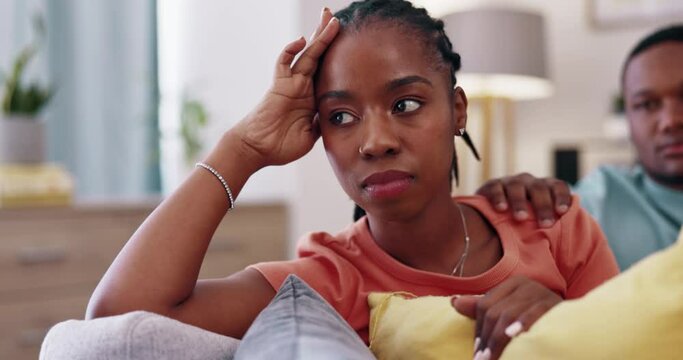 Couple, divorce and an angry black woman on a sofa in the home living room ignoring her husband. Argue, unhappy and upset with a young female giving her boyfriend the silent treatment during a fight