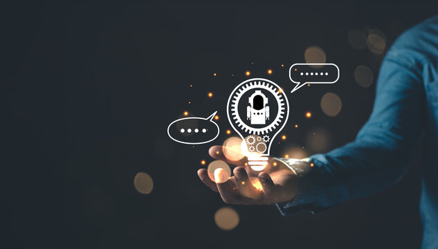 man hold lightblub icon and command prompt ai chat. Big data storage.Digital Artificial Intelligence (AI) technology disruption concept. We are implementing storage technology support in the business.