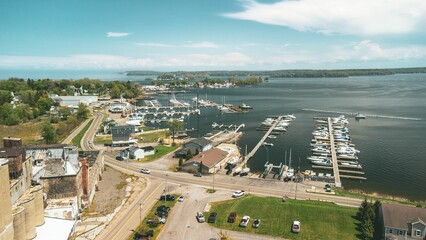an aerial view of a boat dock near a town that is about 5 miles away