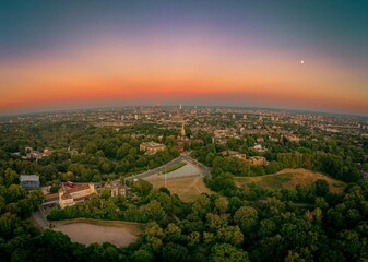 Landscape view of the he Hampstead with multiple buildings and parks at sunset