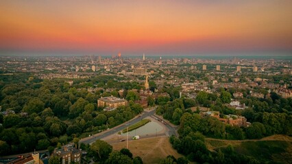 Aerial view of the Whitestone Walk, Hampstead with tall buildings and trees at sunset
