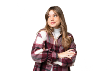 Young girl over isolated chroma key background making doubts gesture while lifting the shoulders