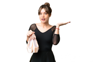 Young girl practicing ballet over isolated chroma key background with shocked facial expression